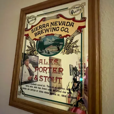 Sale Photo Thumbnail #85: Vintage Sierra Nevada Brewing Co. advertising bar mirror in a molded wood frame.