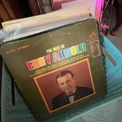 Sale Photo Thumbnail #97: Collection of vintage vinyl LP records in a plastic crate, featuring "The Best of Eddy Arnold" on RCA Victor.