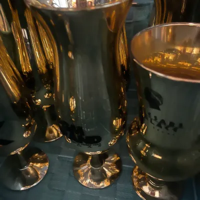 Sale Photo Thumbnail #13: Collection of vintage gold electroplated Las Vegas casino hurricane glasses, featuring branding from the Palms and Sam's Town.