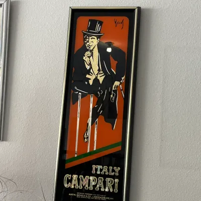 Sale Photo Thumbnail #250: Framed vintage Campari mirror sign featuring iconic Art Deco style graphics in a black and gold frame.