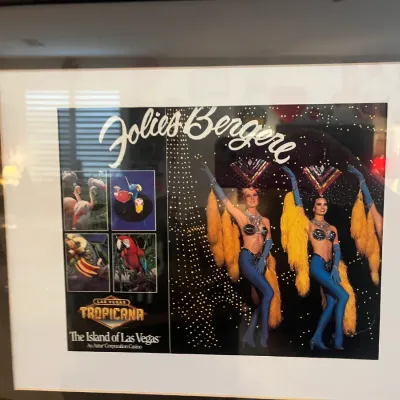 Sale Photo Thumbnail #140: Framed vintage promotional photograph for the Folies Bergere show at the Tropicana Hotel and Casino in Las Vegas, presented in a matted dark frame.