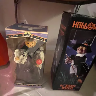 Sale Photo Thumbnail #90: Two boxed Halloween animatronic decorations, including a pumpkin-headed witch in a window box and a 24-inch Sonic Witch in original packaging.