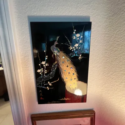 Sale Photo Thumbnail #119: Vintage Asian black lacquer wall panel with mother-of-pearl inlay depicting a peacock perched on a flowering branch.