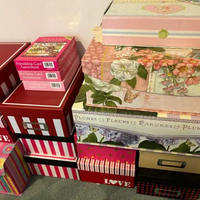 Sale Photo Thumbnail #216: Collection of decorative storage boxes, photo organization containers, and boxed greeting card assortments in various floral and striped patterns.