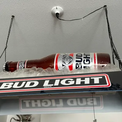 Sale Photo Thumbnail #254: Vintage hanging Bud Light pool table light fixture featuring a 3D beer bottle resting in a faux ice bed.