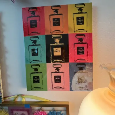 Sale Photo Thumbnail #103: Pop art style wall print featuring a grid of colorful Chanel No. 5 perfume bottle illustrations.