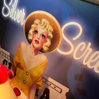 Sale Photo Thumbnail #38: Vintage-style 'Silver Screen' Hollywood pin-up girl canvas wall art featuring a blonde woman in a yellow dress and wide-brimmed hat.