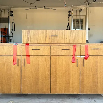 Sale Photo Thumbnail #20: Large light oak wood laminate storage cabinet with upper drawers, lower doors, and an additional matching top drawer unit.