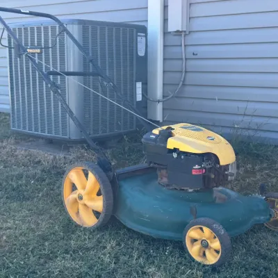 Sale Photo Thumbnail #19: Gas-powered push lawn mower featuring a Briggs & Stratton engine.