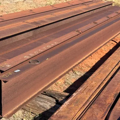Sale Photo Thumbnail #14: Stack of heavy-duty steel I-beams.