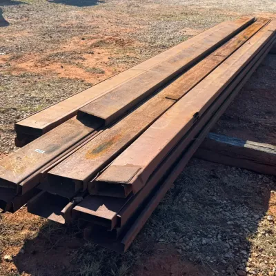 Sale Photo Thumbnail #13: Stack of long structural steel C-channel and rectangular tubing.