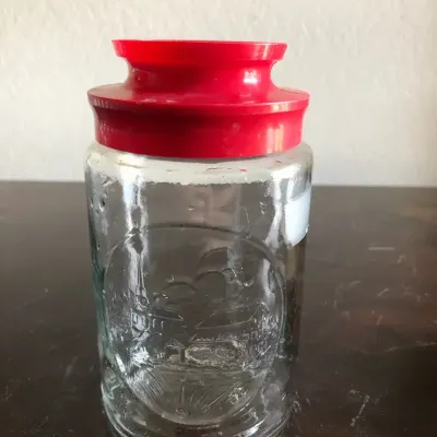 Embossed Glass Storage Jar with Red Plastic Lid, Scenic Design
