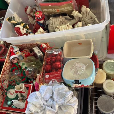 Sale Photo Thumbnail #42: Collection of festive Christmas decorations and holiday collectibles packed in plastic totes and decorative boxes, including figurines, mini ball ornaments, and bows.