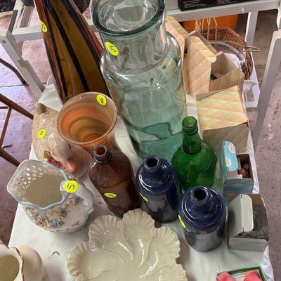 Sale Photo Thumbnail #58: Collection of vintage glass and ceramic items, including colorful vases, decorative bottles, a reticulated floral pitcher, and an oyster plate.