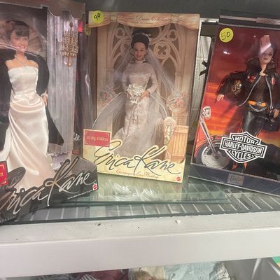 Sale Photo Thumbnail #100: Trio of collectible boxed Barbie dolls from the late 1990s to early 2000s, including two All My Children Erica Kane dolls and a Harley-Davidson Barbie.