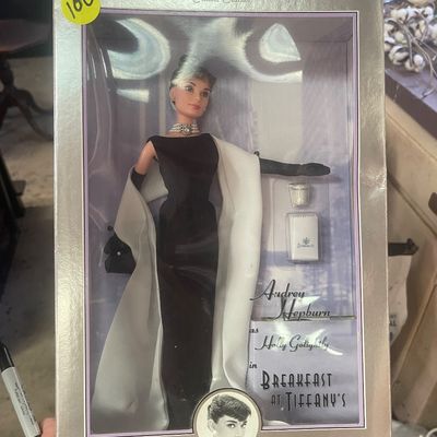 Sale Photo Thumbnail #98: Audrey Hepburn as Holly Golightly in Breakfast at Tiffany's Classic Edition Barbie doll, mint in original box.
