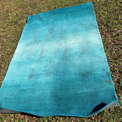 Sale Photo Thumbnail #11: 5’x7’ Rectangular area rug with a teal gradient pattern. 