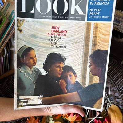 Sale Photo Thumbnail #2: April 10, 1962 issue of LOOK magazine featuring Judy Garland and her children on the cover. The magazine shows light edge wear and a small tear on the lower left front cover.