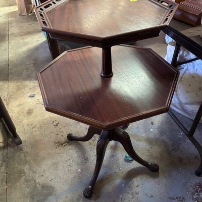Sale Photo Thumbnail #81: Vintage dark mahogany two-tier octagonal accent table featuring a pierced gallery rim on the top tier and carved pedestal tripod legs with ball-and-claw feet.