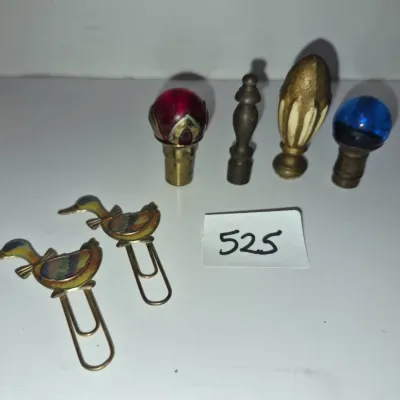 Sale Photo Thumbnail #907: Collection of decorative vintage hardware including two brass and cloisonne duck paper clips and four unique lamp finials with glass and metal details.