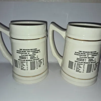 Sale Photo Thumbnail #614: Pair of vintage Super Bowl XXII Washington Redskins commemorative ceramic steins detailing the 1987 championship season record.