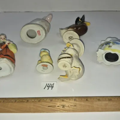 Sale Photo Thumbnail #245: Collection of six ceramic animal and bird figurines, including a Lenox duck, shown alongside a wooden ruler for scale.