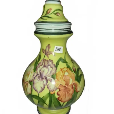 Sale Photo Thumbnail #637: Hand-painted Art Nouveau satin glass urn with a matching lid, featuring detailed iris flowers against a lime green background.