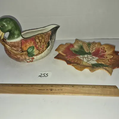 Sale Photo Thumbnail #435: Autumn-themed ceramic mallard duck gravy boat with a matching leaf-shaped underplate.
