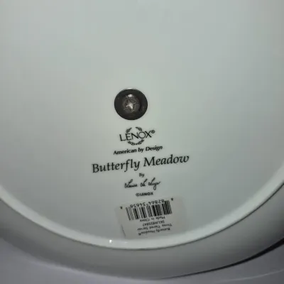 Sale Photo Thumbnail #630: Underside maker's mark and barcode sticker on a Lenox Butterfly Meadow three-tiered server plate, designed by Louise Le Luyer.