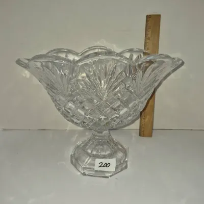 Sale Photo Thumbnail #341: Large footed cut crystal centerpiece bowl featuring intricate criss-cross and fan patterns with a scalloped rim.