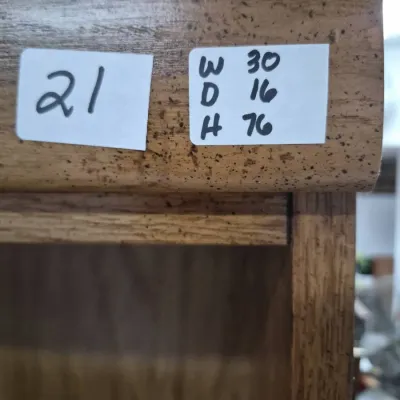 Sale Photo Thumbnail #35: Close-up of a wooden furniture piece displaying lot number 21 and handwritten dimensions sticker.
