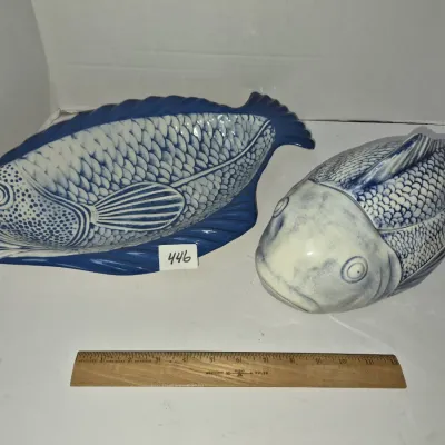 Sale Photo Thumbnail #772: Pair of blue and white ceramic fish-shaped serving pieces, including an open serving platter and a covered tureen with detailed scale patterns.