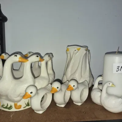 Sale Photo Thumbnail #557: Vintage white ceramic duck theme tableware set, including a centerpiece bowl, pitcher, candle holder with pillar candle, and napkin rings.