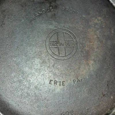 Sale Photo Thumbnail #632: Vintage Griswold cast iron handle griddle No. 8 (pattern 608) with small block logo, made in Erie, PA.