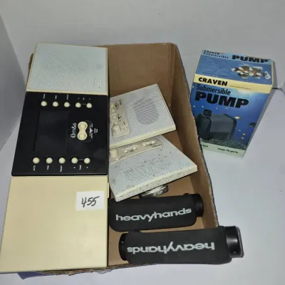 Sale Photo Thumbnail #787: Box lot containing M&S home intercom system components, a pair of Heavyhands foam weight grips, and a vintage Craven submersible pump in its original box.