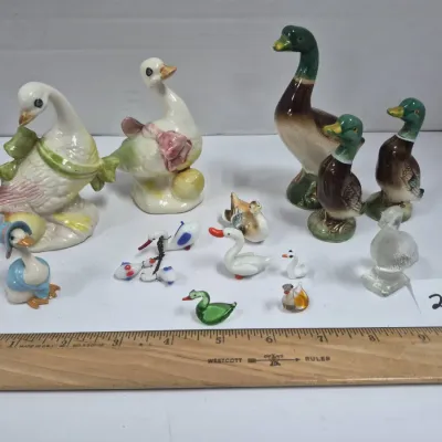 Sale Photo Thumbnail #464: Collection of assorted miniature duck and goose figurines in ceramic, porcelain, and glass.