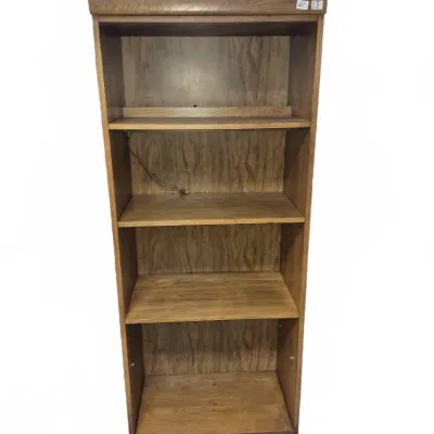 Sale Photo Thumbnail #34: Tall oak bookcase featuring four shelves and built-in lighting.