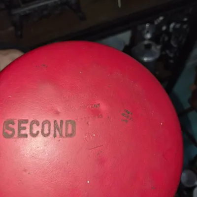 Sale Photo Thumbnail #561: Bottom of a vintage red cast iron cookware piece stamped with 'SECOND' and patent details.
