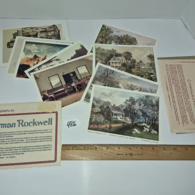 Sale Photo Thumbnail #834: Collection of vintage art print lithographs, featuring works by Currier & Ives and Norman Rockwell, accompanied by descriptive inserts and a wooden Westcott ruler for scale.