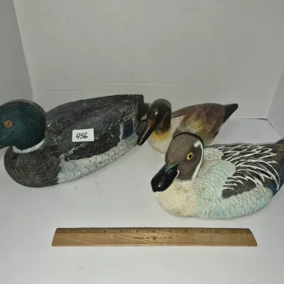 Sale Photo Thumbnail #788: Trio of hand-painted duck decoys featuring a large mallard drake and two smaller species, shown next to a 12-inch ruler for scale.