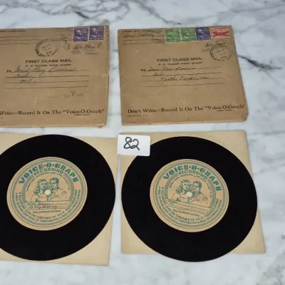 Sale Photo Thumbnail #131: Two 1940s Voice-O-Graph phonograph record voice letters with original postmarked mailing envelopes.