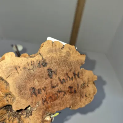 Sale Photo Thumbnail #274: Hand-carved wooden object base, signed and dated '11-1988 by Roy L White, Knotts Island, NC'.
