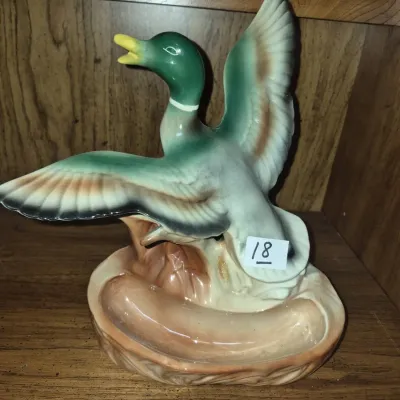 Sale Photo Thumbnail #28: Vintage ceramic mallard duck figurines tray, depicting a duck in flight above a naturalistic catchall base, measuring approximately eight inches high.