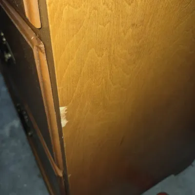 Sale Photo Thumbnail #20: Close-up detail of a wooden dresser showing a small chip on the front edge.