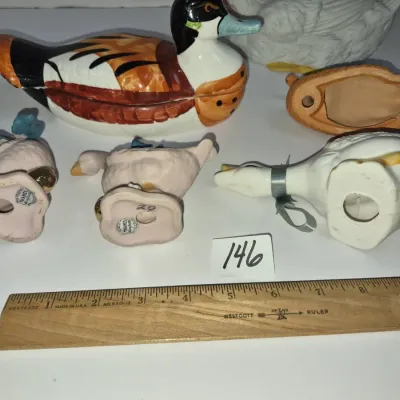 Sale Photo Thumbnail #248: Collection of vintage ceramic waterfowl figurines and trinket dishes, including a painted mallard duck container and small goose figurines.