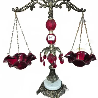 Sale Photo Thumbnail #540: Vintage Hollywood Regency style decorative scale of justice with ornate brass stand, marble base, and ruby red glass ruffled bowls.