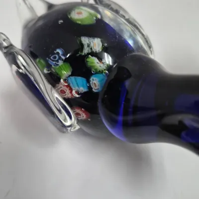 Sale Photo Thumbnail #370: Murano-style blown glass bird figurine featuring a cobalt blue core with multicolored millefiori cane details.