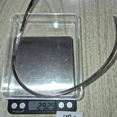 Sale Photo Thumbnail #855: Polished silver-tone collar necklace or choker resting on a Fuzion digital scale displaying a weight of 29.29 grams.