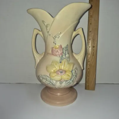Sale Photo Thumbnail #263: Vintage Hull Pottery Freesia pattern double-handled urn vase in cream, pink, and yellow, measuring approximately 12 inches tall.