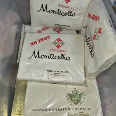 Sale Photo Thumbnail #88: Vintage Cannon bed sheets, including Monticello no-iron full size sheets and a Combspun Percale Royal Family double bed sheet, all new old stock in original plastic packaging.